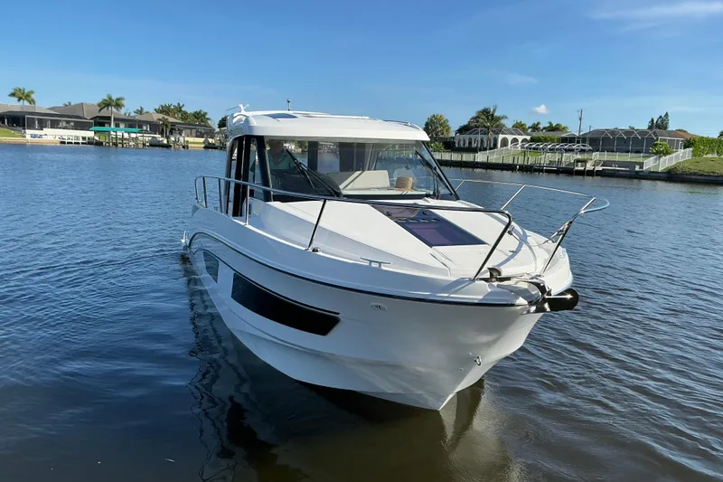 Slide: The Image of 2022 Beneteau Antares 9 boat on calm water, showcasing sleek design and modern features. - 39