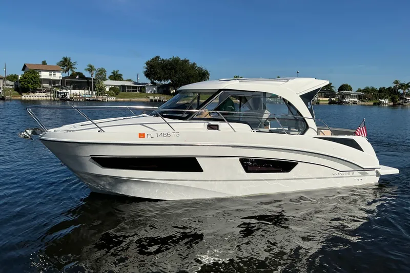 Slide: The Image of 2022 Beneteau Antares 9 boat on calm water, showcasing sleek design and modern features. - 41