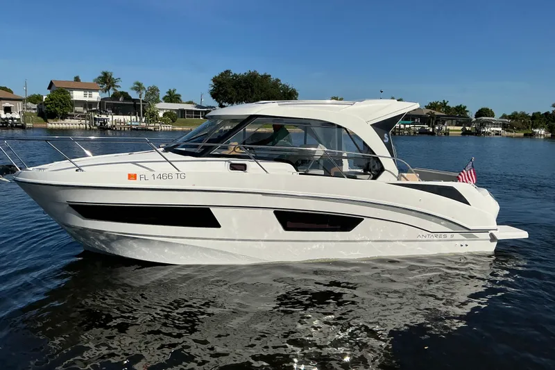Slide: The Image of 2022 Beneteau Antares 9 boat on calm water, showcasing sleek design and modern features. - 42