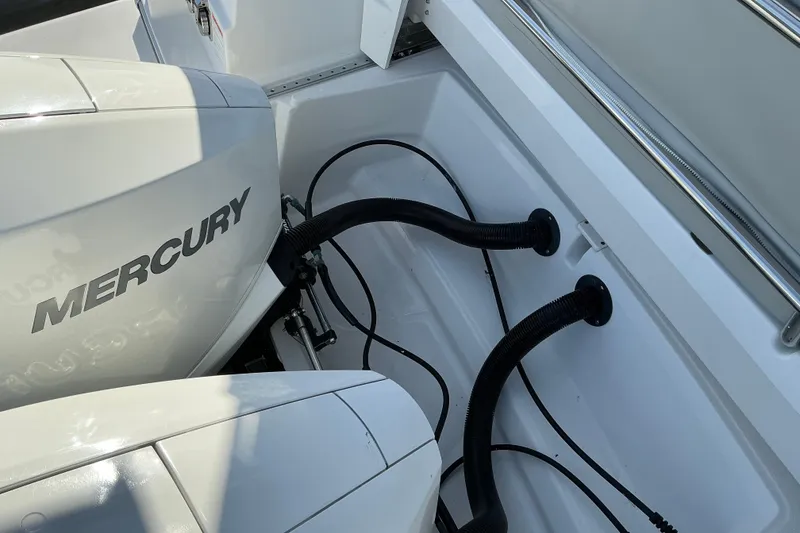 Slide: The Image of Mercury engine on 2022 Beneteau Antares 9 boat, featuring sleek design and cables. - 9