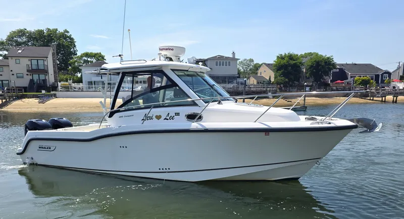The Image of 2016 Boston Whaler 285 Conquest boat on calm water. - 0