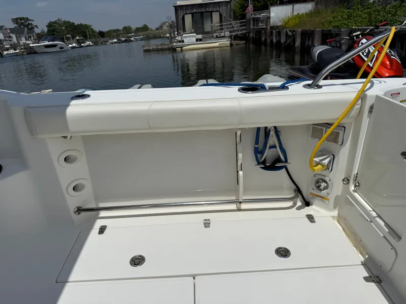 Slide: The Image of Interior view of a 2016 Boston Whaler 285 Conquest boat at dock. - 13