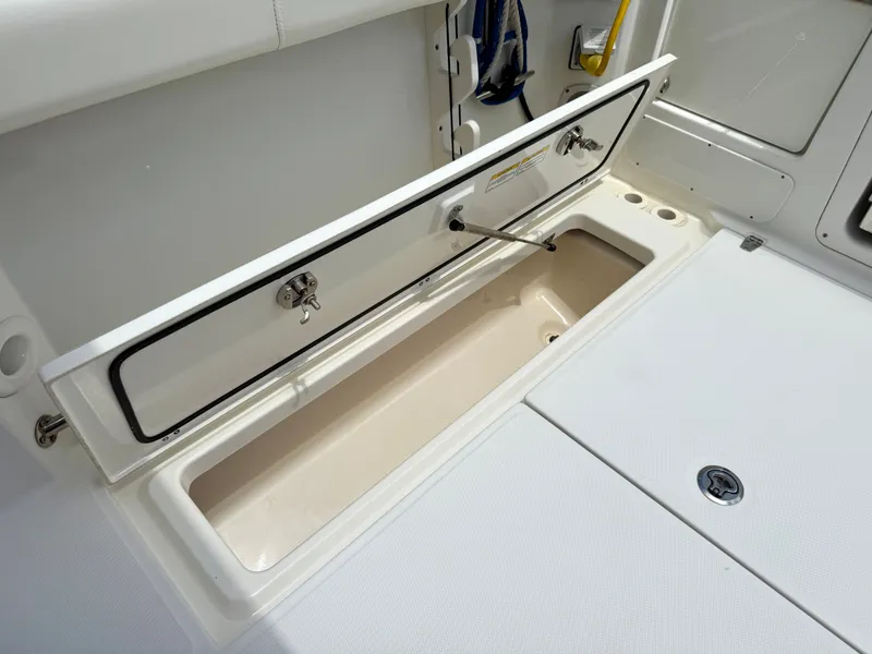 Slide: The Image of Storage compartment on a 2016 Boston Whaler 285 Conquest boat. - 15