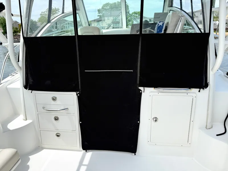 Slide: The Image of Interior of 2016 Boston Whaler 285 Conquest with storage compartments. - 16