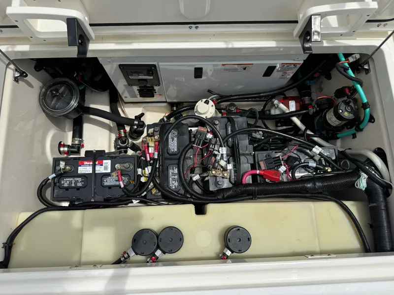 Slide: The Image of Engine compartment of 2016 Boston Whaler 285 Conquest with batteries and wiring. - 18