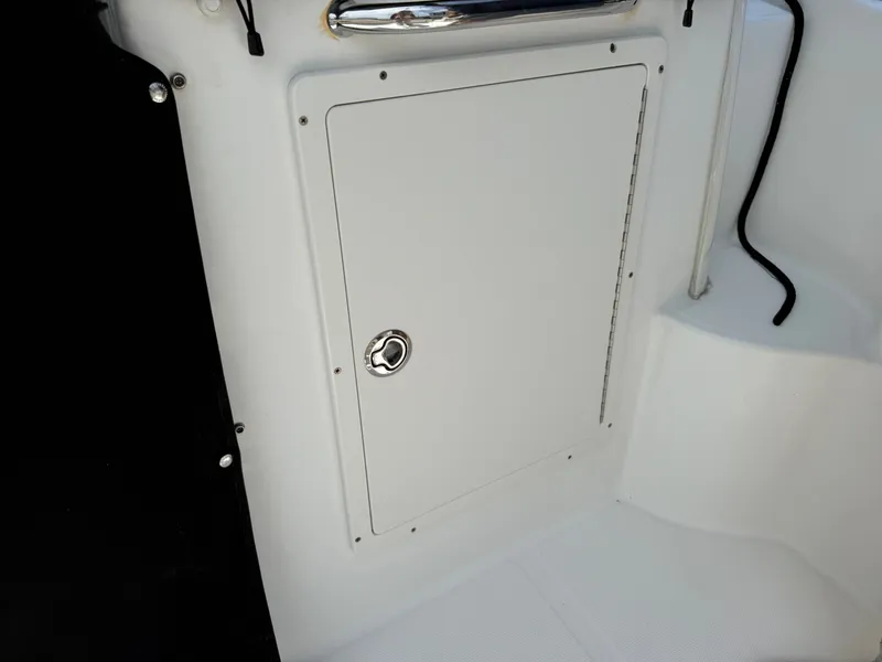 Slide: The Image of Storage hatch on a 2016 Boston Whaler 285 Conquest boat. - 19