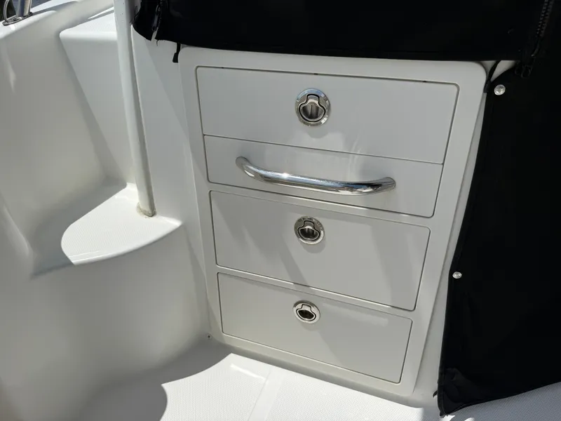 Slide: The Image of Boston Whaler 285 Conquest 2016, white cockpit drawers. - 20