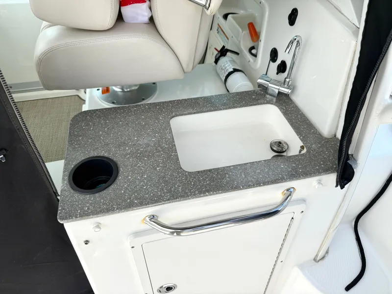 Slide: The Image of 2016 Boston Whaler 285 Conquest interior with sink and seat. - 22