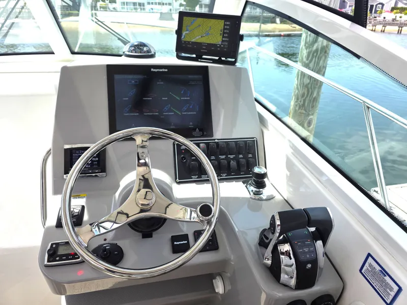 Slide: The Image of 2016 Boston Whaler 285 Conquest helm with navigation system. - 25