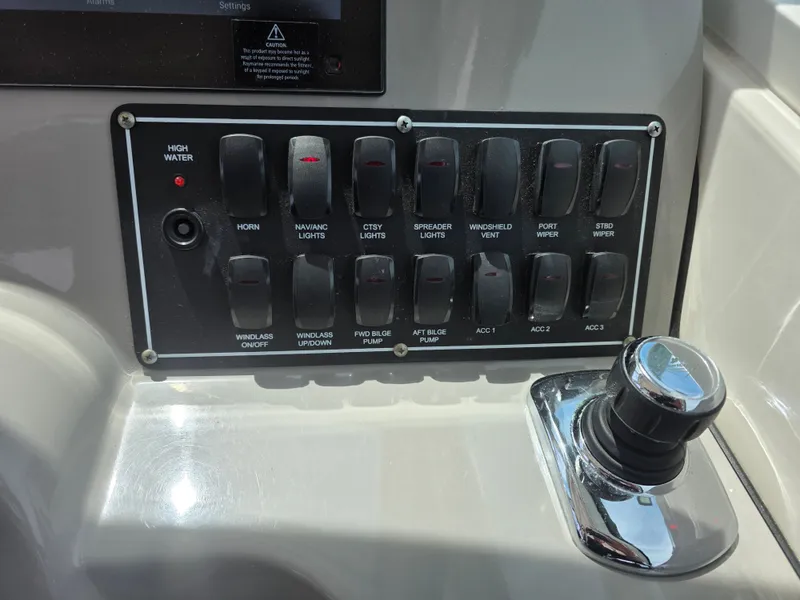 Slide: The Image of Control panel of a 2016 Boston Whaler 285 Conquest boat. - 28