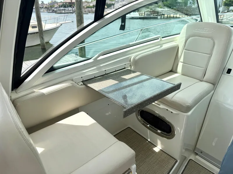 Slide: The Image of Interior of 2016 Boston Whaler 285 Conquest with seating and table. - 29