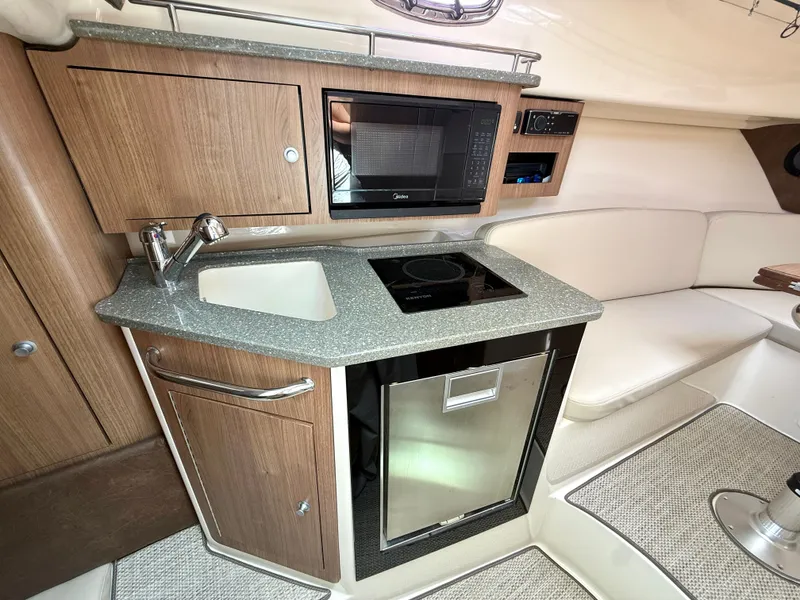 Slide: The Image of Interior of 2016 Boston Whaler 285 Conquest with kitchenette. - 35