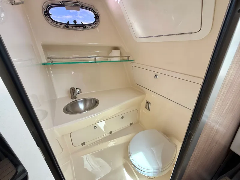 Slide: The Image of Interior view of 2016 Boston Whaler 285 Conquest boat bathroom. - 41