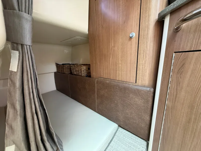 Slide: The Image of Interior of 2016 Boston Whaler 285 Conquest with wooden cabinets. - 43