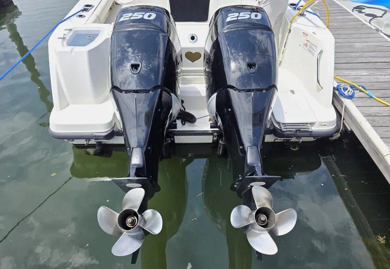 Slide: The Image of Boston Whaler 285 Conquest 2016 with twin outboard engines at dock. - 6