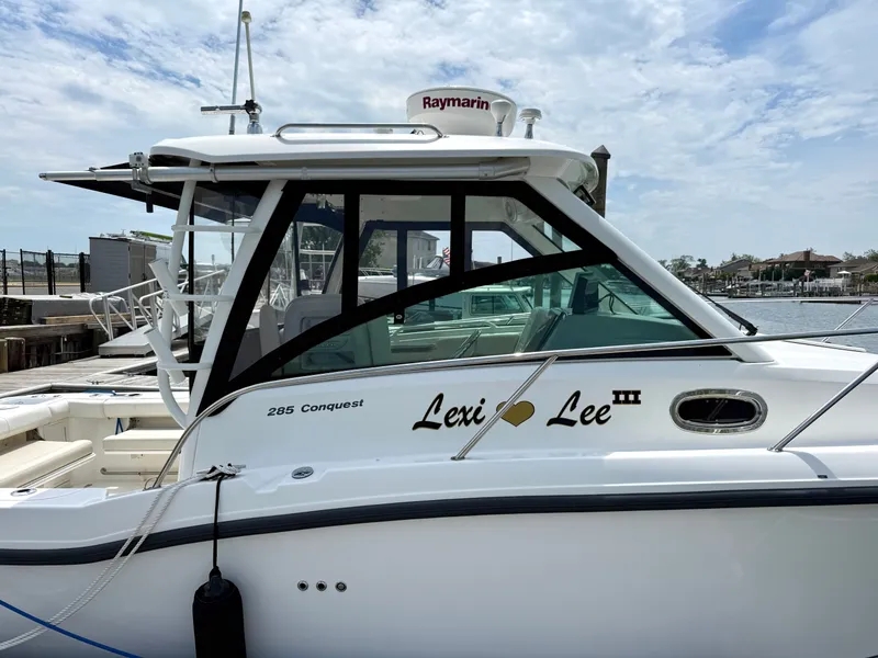 Slide: The Image of Boston Whaler 285 Conquest 2016 at dock, side view. - 7