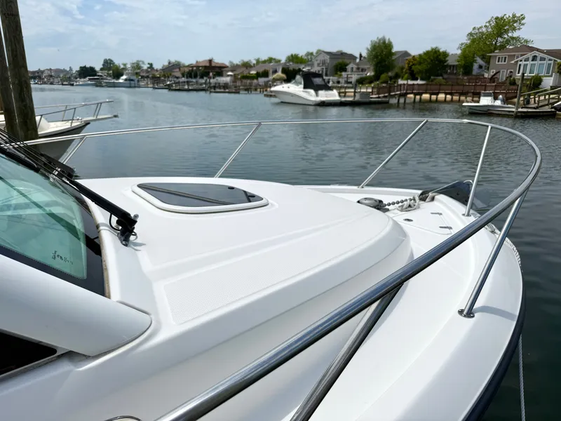 Slide: The Image of 2016 Boston Whaler 285 Conquest anchored on calm waters. - 8
