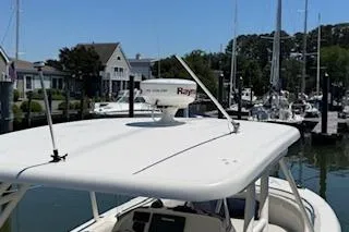 Slide: The Image of 2014 Pursuit S 280 Sport boat docked in a marina with clear skies. - 13