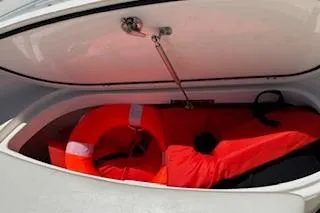 Slide: The Image of Storage compartment of 2014 Pursuit S 280 Sport boat with life jackets inside. - 23