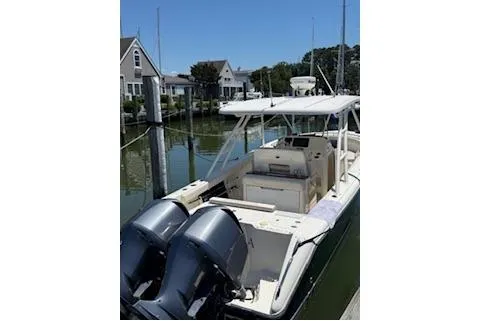 Slide: The Image of 2014 Pursuit S 280 Sport boat docked with dual engines. - 6