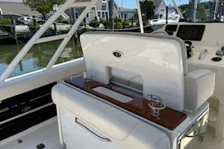 Slide: The Image of 2014 Pursuit S 280 Sport boat interior with sleek seating and modern controls. - 9