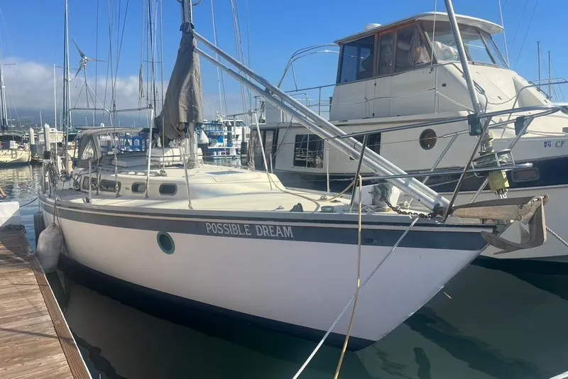 The Image of 1971 Santana 37 sailboat named "Possible Dream" docked at a marina. - 1