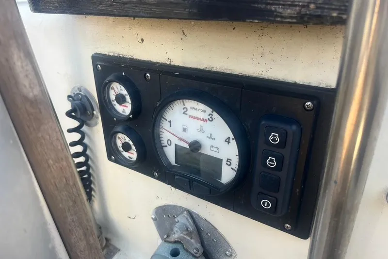 Slide: The Image of Control panel of a 1971 Santana 37 sailboat with Yanmar engine gauges. - 11