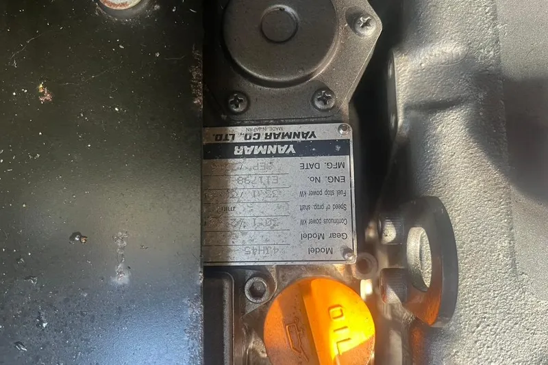 Slide: The Image of Close-up of a Yanmar engine plate on a 1971 Santana 37. - 23