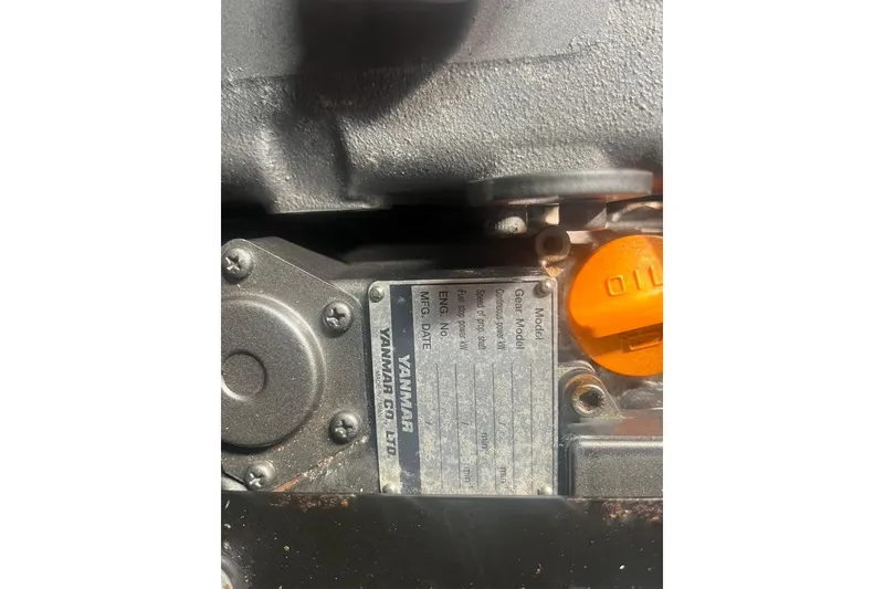 Slide: The Image of Close-up of a Yanmar engine plate on a 1971 Santana 37. - 24