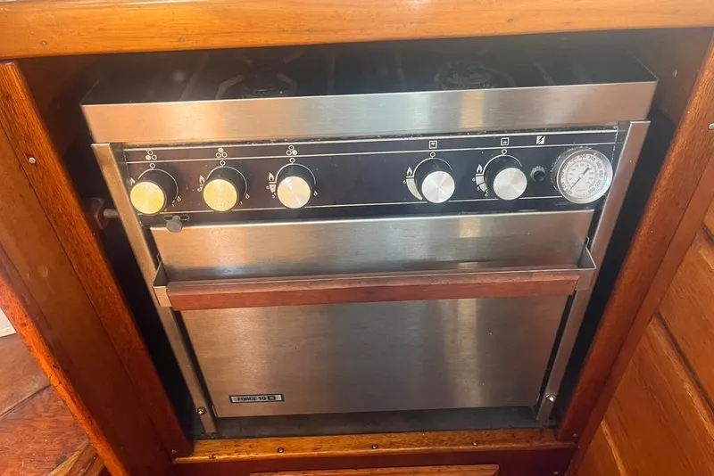 Slide: The Image of Stainless steel stove and oven in a 1971 Santana 37 yacht kitchen. - 25