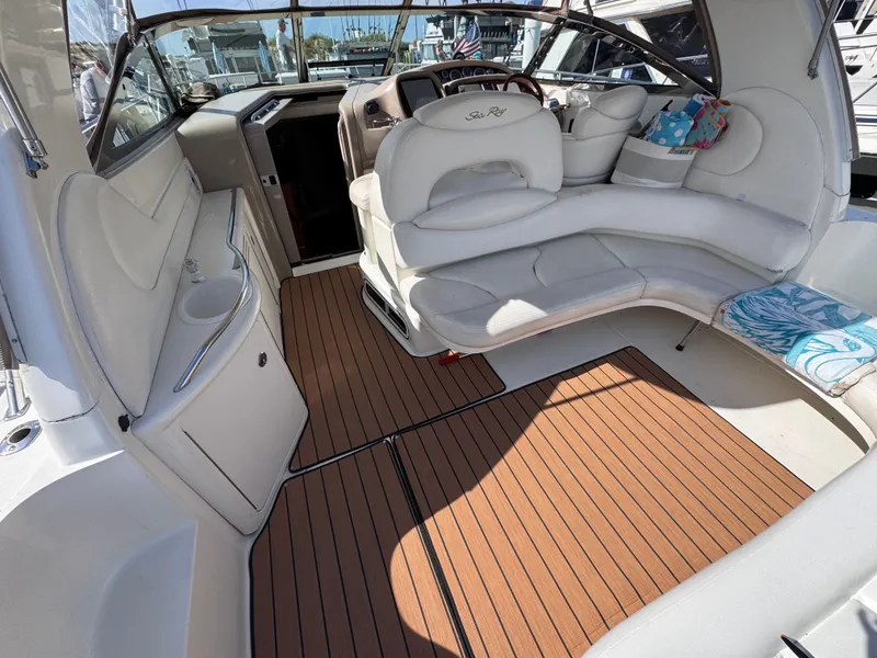 Slide: The Image of Interior of a 1999 Sea Ray 38 Sundancer yacht with wood flooring. - 11