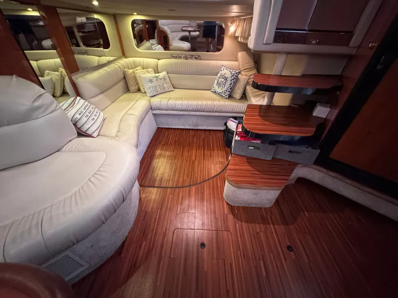 Slide: The Image of Interior of a 1999 Sea Ray 38 Sundancer yacht with elegant leather seating. - 18