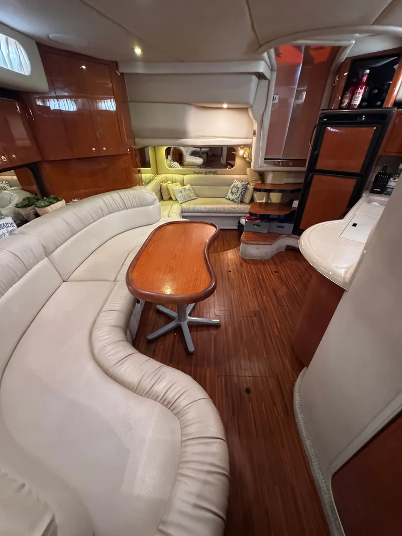 Slide: The Image of Interior of a 1999 Sea Ray 38 Sundancer yacht with elegant furnishings. - 21