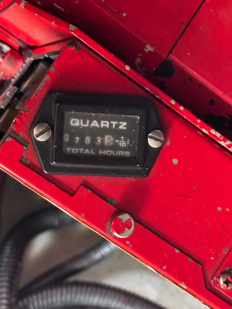 Slide: The Image of Hour meter on red background, displaying 703 hours. - 25