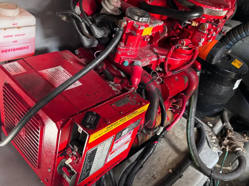 Slide: The Image of Westerbeke generator in the engine room of a 1999 Sea Ray 38 Sundancer. - 26