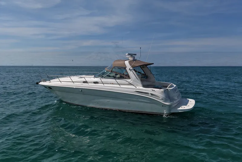 Slide: The Image of 1999 Sea Ray 38 Sundancer on open sea. - 27