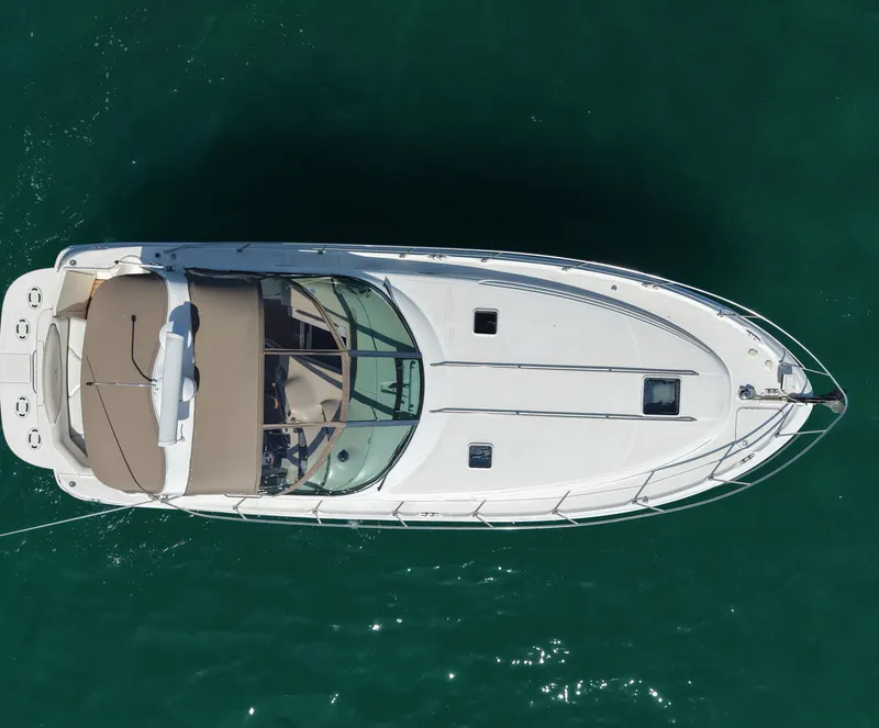 Slide: The Image of Aerial view of a 1999 Sea Ray 38 Sundancer on the water. - 4