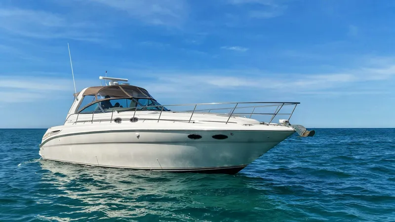 Slide: The Image of 1999 Sea Ray 38 Sundancer on open sea. - 8