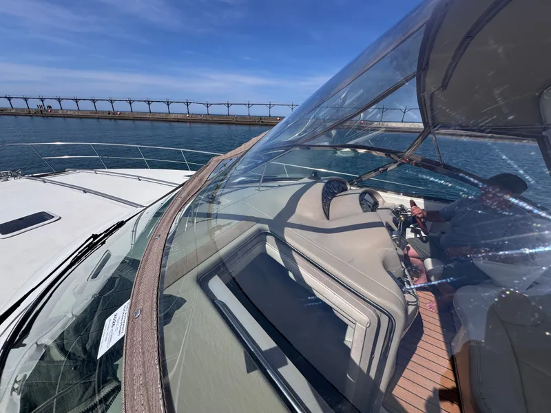 Slide: The Image of 1999 Sea Ray 38 Sundancer on water with helmsman. - 9