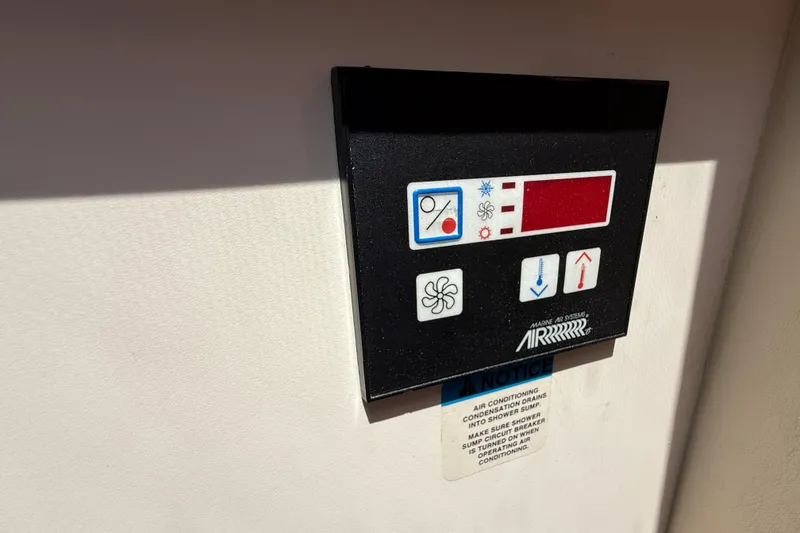 Slide: The Image of Control panel for air conditioning on a 1999 Silverton 322 Motor Yacht. - 16