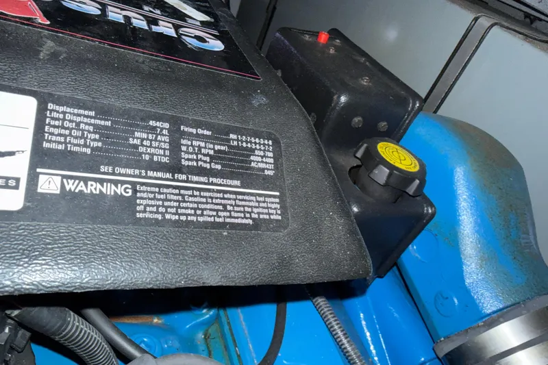 Slide: The Image of Engine specifications and warning label on a 1999 Silverton 322 Motor Yacht. - 22