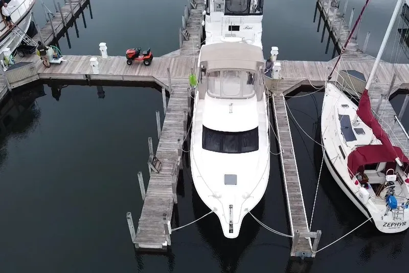 Slide: The Image of Aerial view of a 1999 Silverton 322 Motor Yacht docked at a marina. - 4
