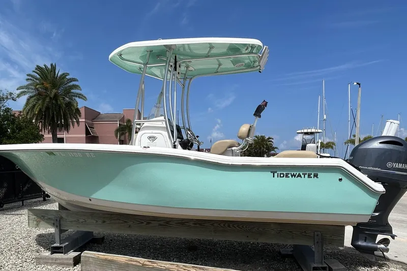 Slide: The Image of 2016 Tidewater 210 LXF boat on display, featuring a sleek design and Yamaha engine. - 1