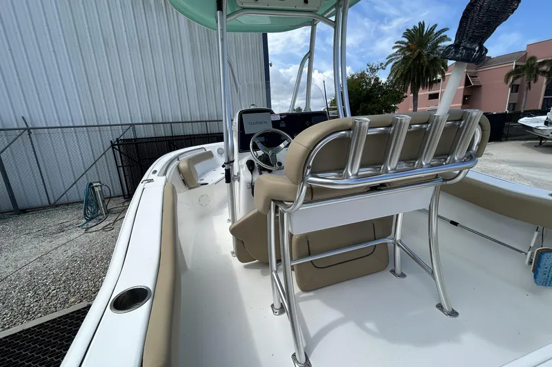 Slide: The Image of 2016 Tidewater 210 LXF boat interior with helm, seating, and rod holders. - 10
