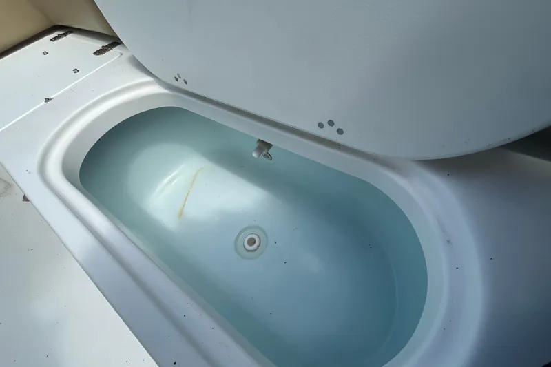 Slide: The Image of Livewell on a 2016 Tidewater 210 LXF boat, partially filled with water. - 13