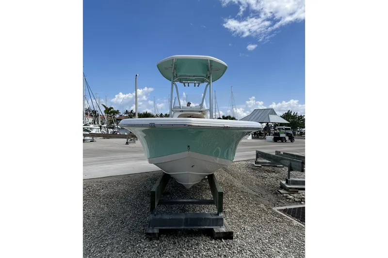 Slide: The Image of 2016 Tidewater 210 LXF boat on trailer under clear blue sky. - 2