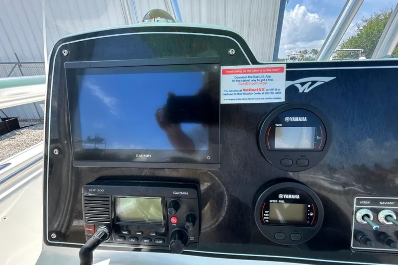 Slide: The Image of Dashboard of a 2016 Tidewater 210 LXF boat featuring Garmin and Yamaha instruments. - 21