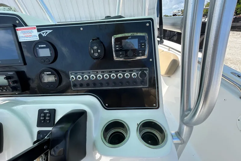 Slide: The Image of Control panel of a 2016 Tidewater 210 LXF boat with navigation instruments. - 22