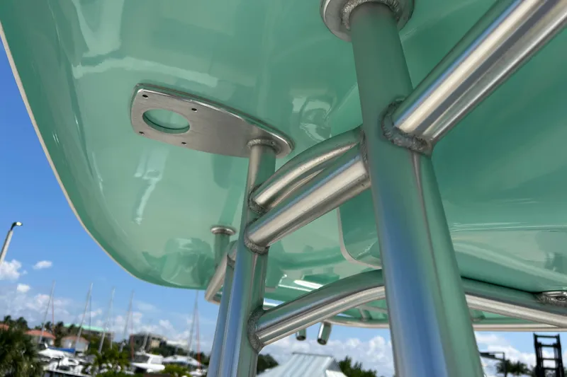 Slide: The Image of Close-up of 2016 Tidewater 210 LXF boat's metal framework against a clear blue sky. - 31