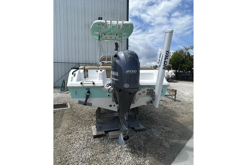 Slide: The Image of 2016 Tidewater 210 LXF boat with Yamaha 200 engine, parked outdoors. - 4